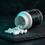 VIGORYS SEED white probiotic capsules poured out on a slate surface. 